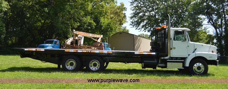 image for item H2873 1999 Volvo WG rollback truck