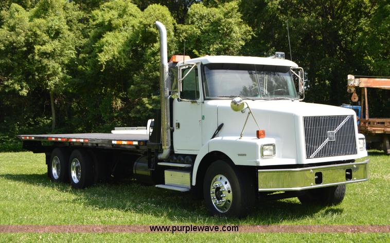 image for item H2873 1999 Volvo WG rollback truck