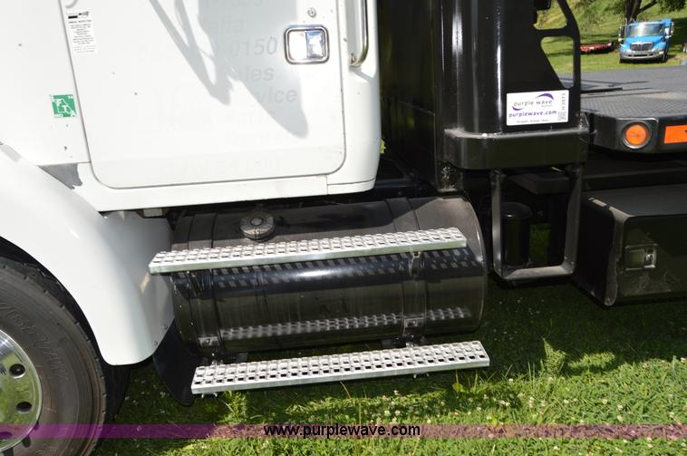 image for item H2873 1999 Volvo WG rollback truck