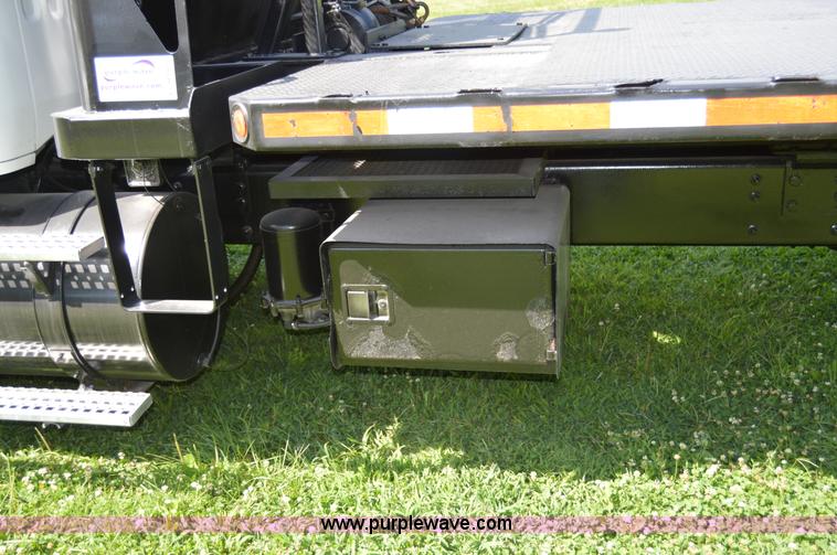 image for item H2873 1999 Volvo WG rollback truck