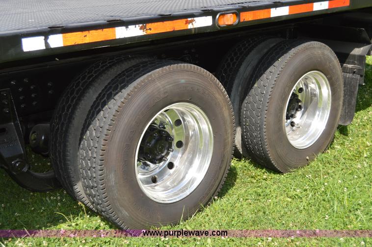 image for item H2873 1999 Volvo WG rollback truck