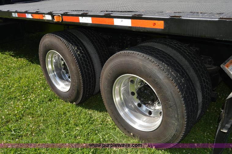 image for item H2873 1999 Volvo WG rollback truck