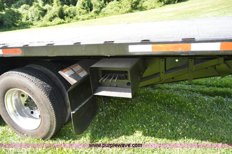 image for item H2873 1999 Volvo WG rollback truck