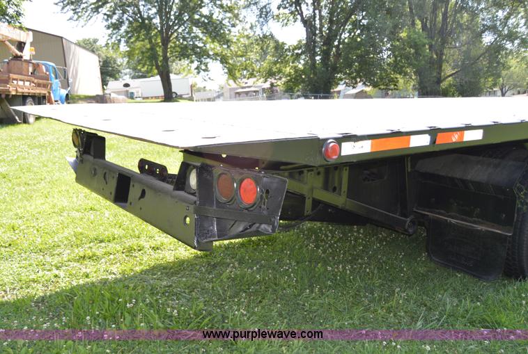 image for item H2873 1999 Volvo WG rollback truck