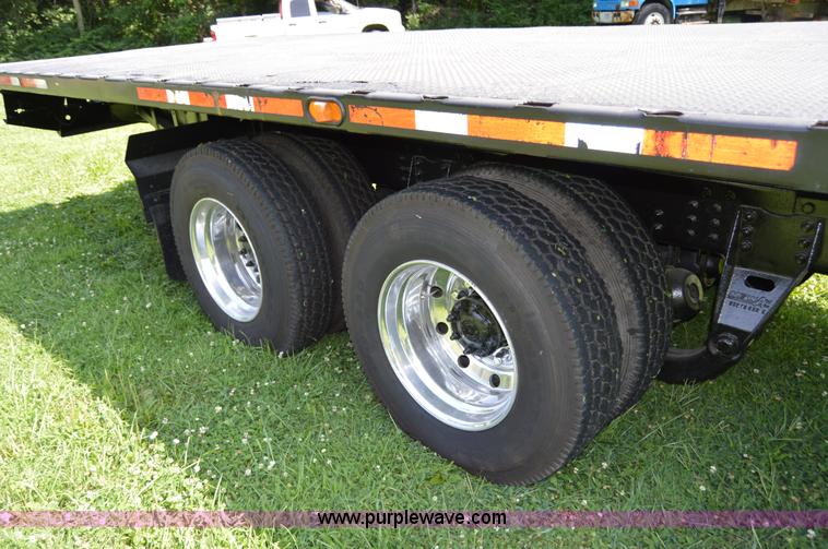 image for item H2873 1999 Volvo WG rollback truck