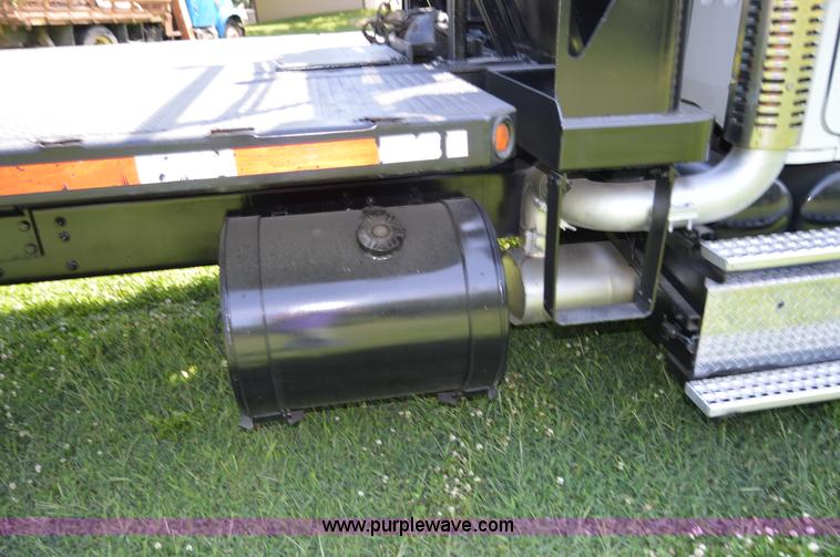 image for item H2873 1999 Volvo WG rollback truck