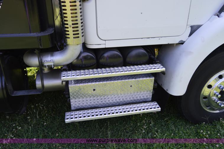 image for item H2873 1999 Volvo WG rollback truck