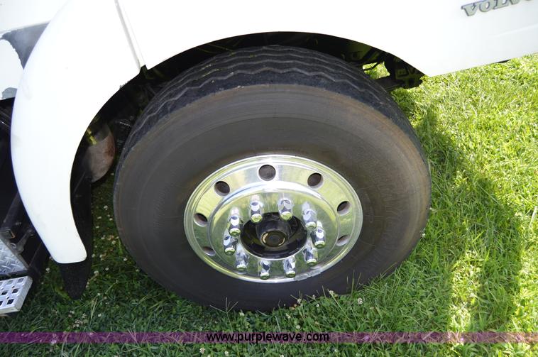 image for item H2873 1999 Volvo WG rollback truck