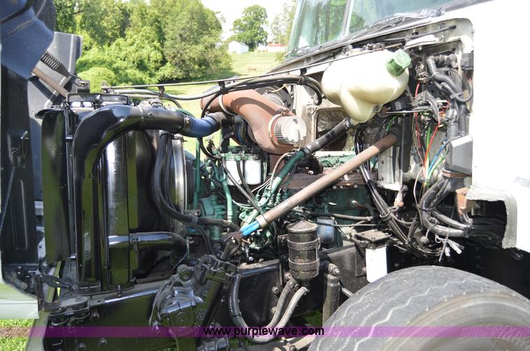 image for item H2873 1999 Volvo WG rollback truck