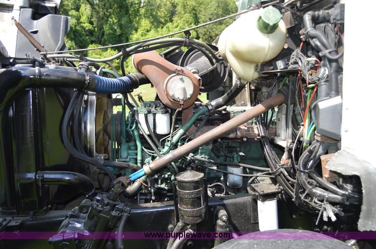 image for item H2873 1999 Volvo WG rollback truck