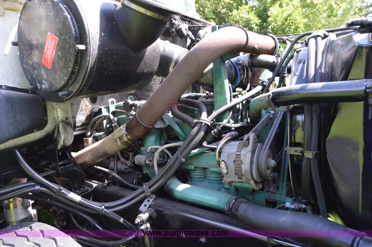 image for item H2873 1999 Volvo WG rollback truck