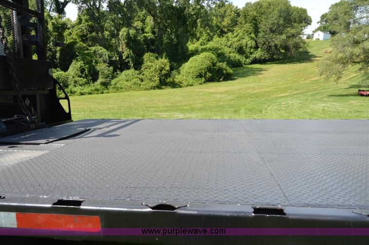 image for item H2873 1999 Volvo WG rollback truck