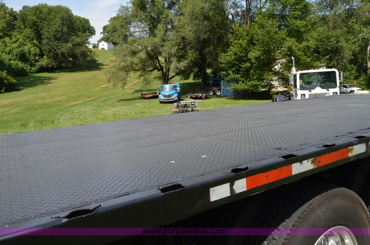 image for item H2873 1999 Volvo WG rollback truck