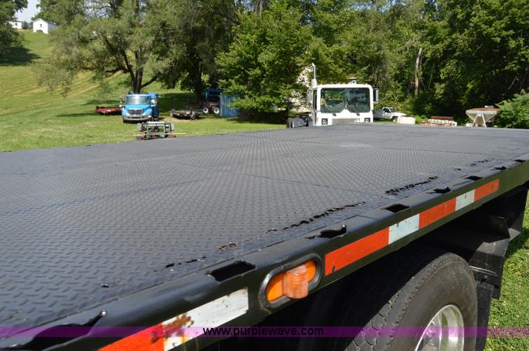 image for item H2873 1999 Volvo WG rollback truck