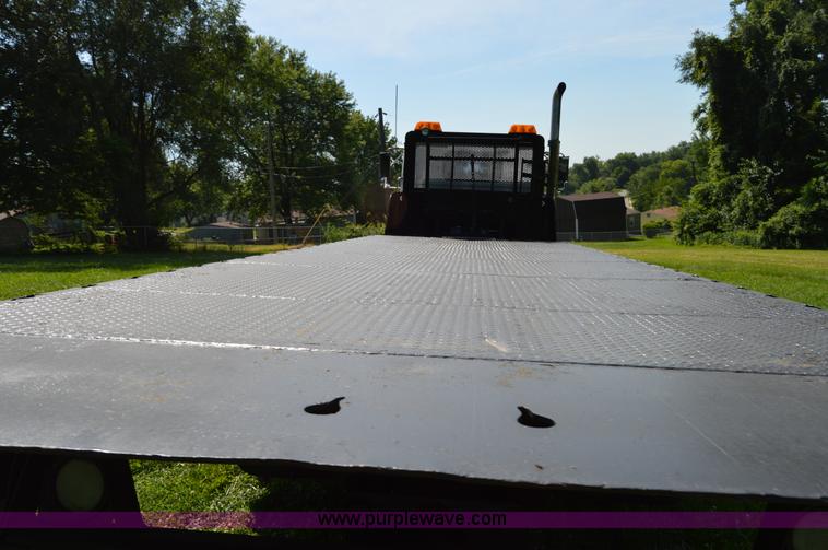 image for item H2873 1999 Volvo WG rollback truck