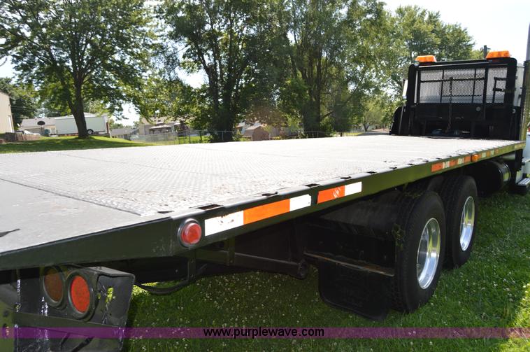 image for item H2873 1999 Volvo WG rollback truck