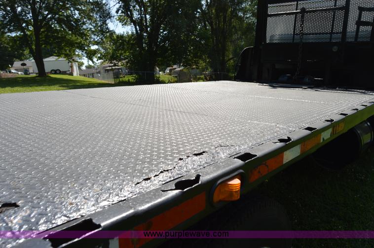 image for item H2873 1999 Volvo WG rollback truck