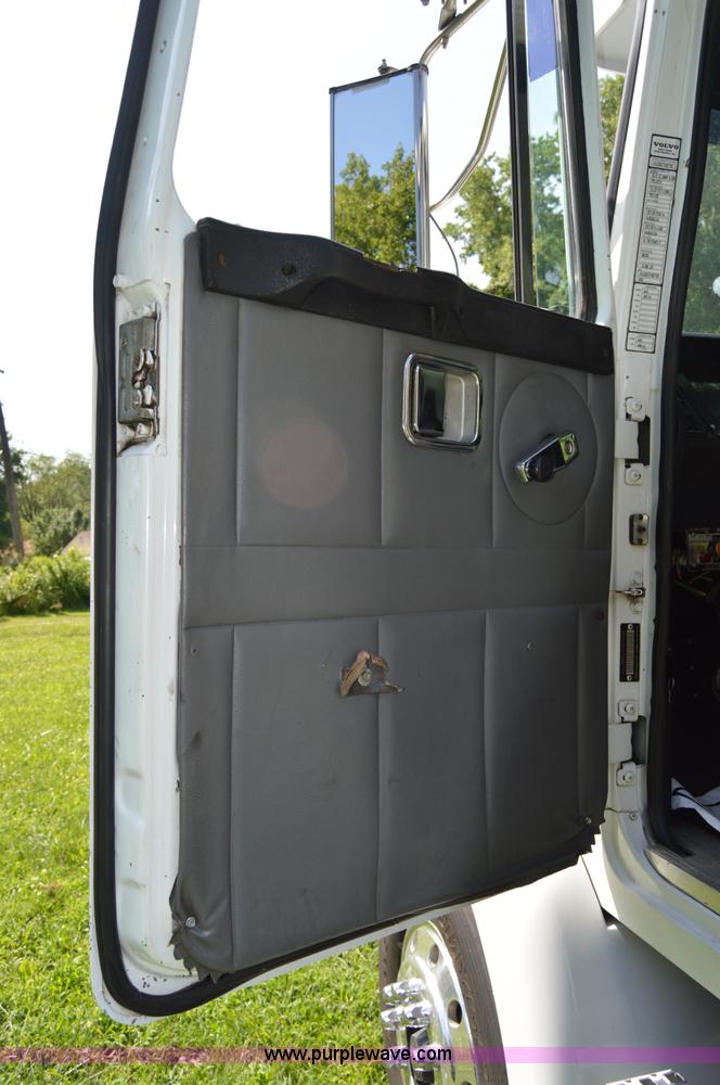 image for item H2873 1999 Volvo WG rollback truck