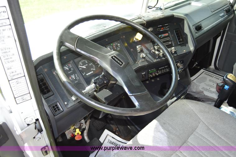 image for item H2873 1999 Volvo WG rollback truck