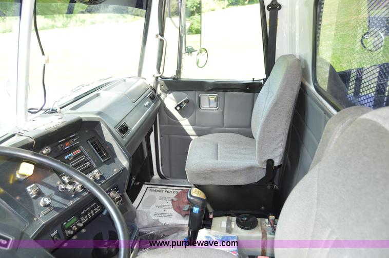 image for item H2873 1999 Volvo WG rollback truck