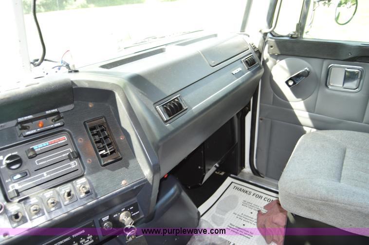 image for item H2873 1999 Volvo WG rollback truck