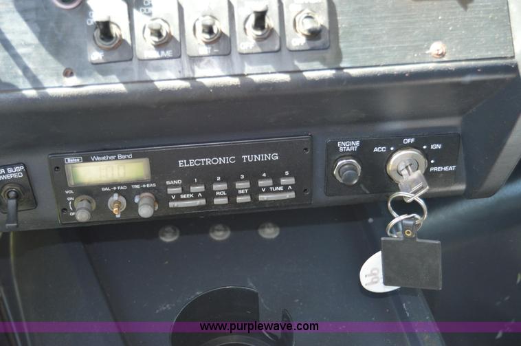 image for item H2873 1999 Volvo WG rollback truck