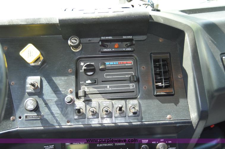 image for item H2873 1999 Volvo WG rollback truck