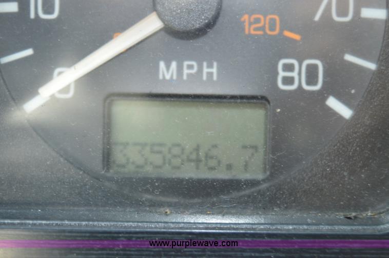 image for item H2873 1999 Volvo WG rollback truck