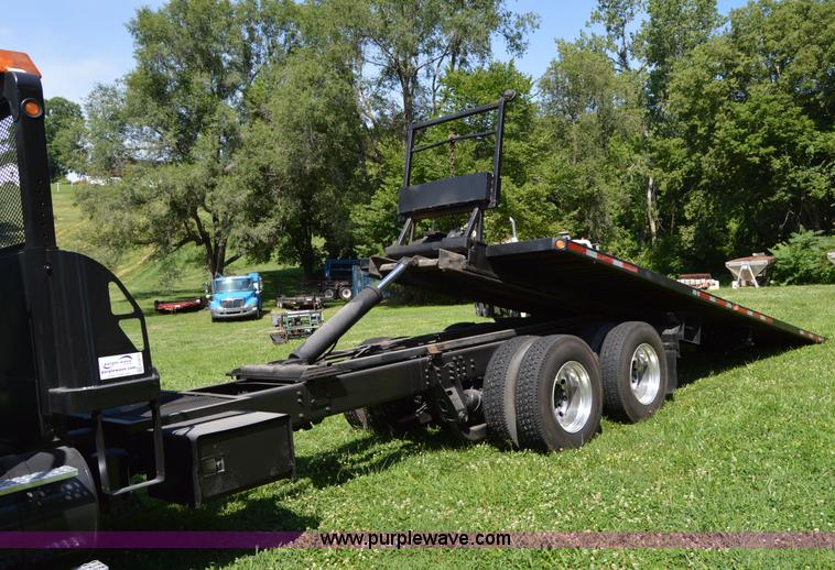 image for item H2873 1999 Volvo WG rollback truck