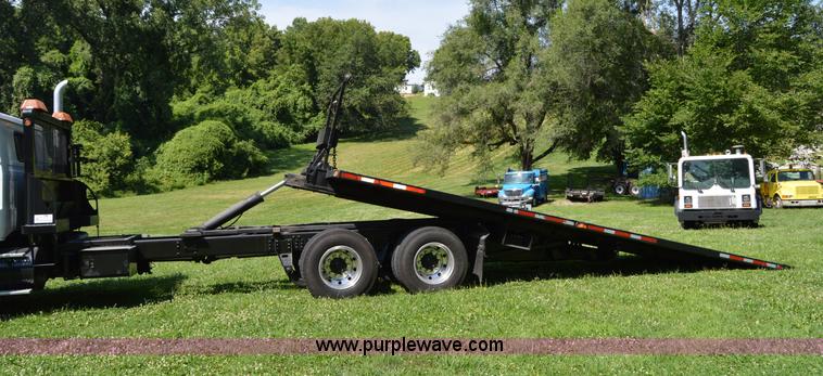 image for item H2873 1999 Volvo WG rollback truck