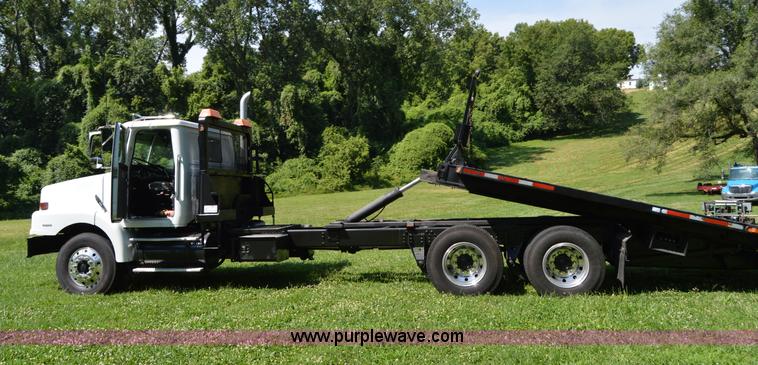 image for item H2873 1999 Volvo WG rollback truck