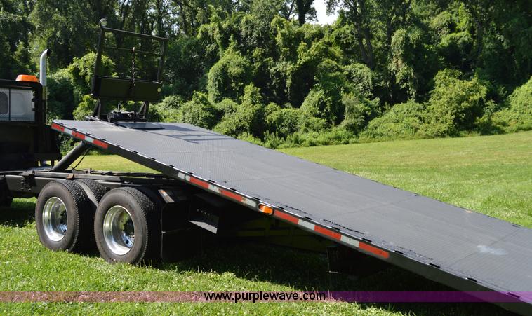 image for item H2873 1999 Volvo WG rollback truck