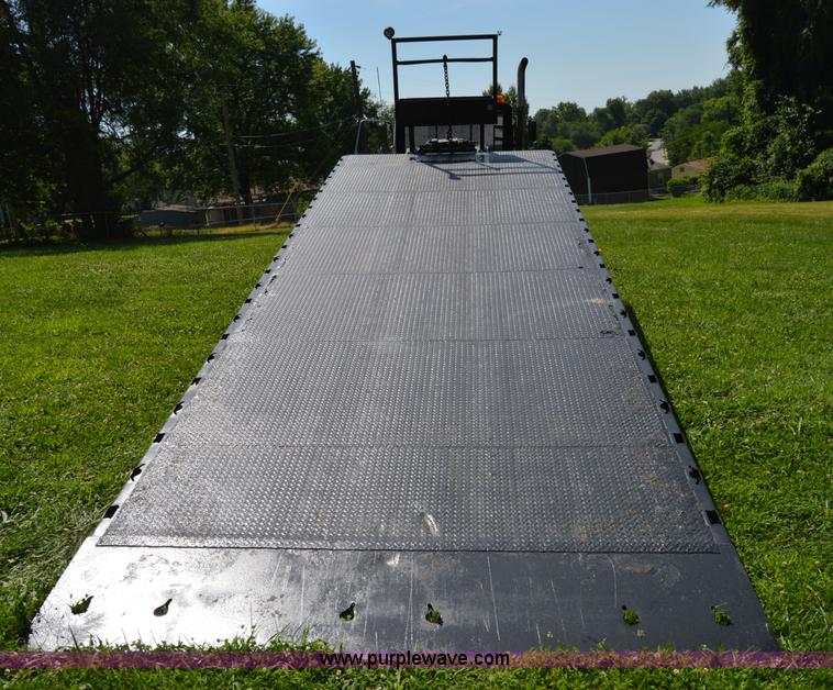 image for item H2873 1999 Volvo WG rollback truck