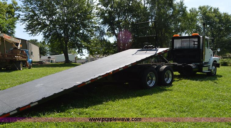 image for item H2873 1999 Volvo WG rollback truck