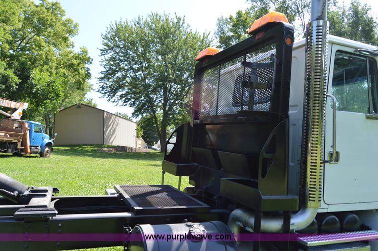 image for item H2873 1999 Volvo WG rollback truck