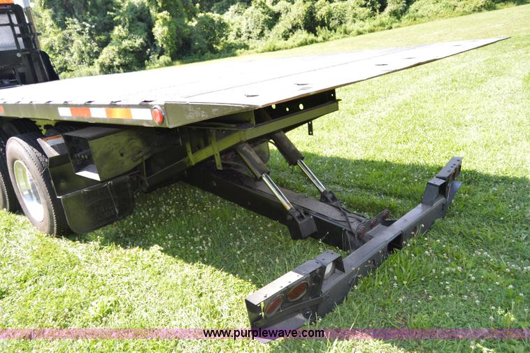 image for item H2873 1999 Volvo WG rollback truck