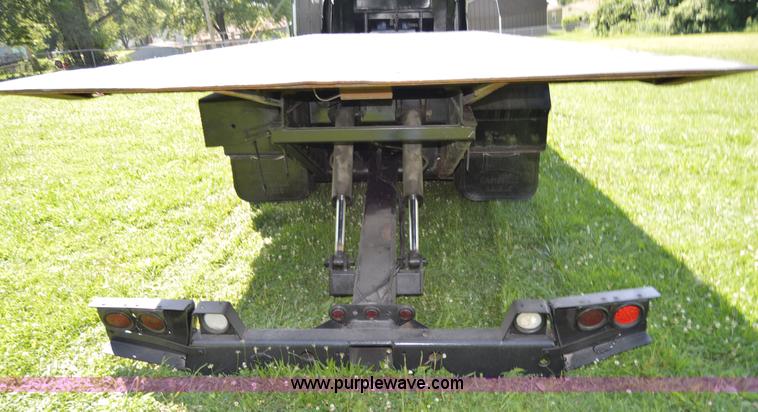 image for item H2873 1999 Volvo WG rollback truck