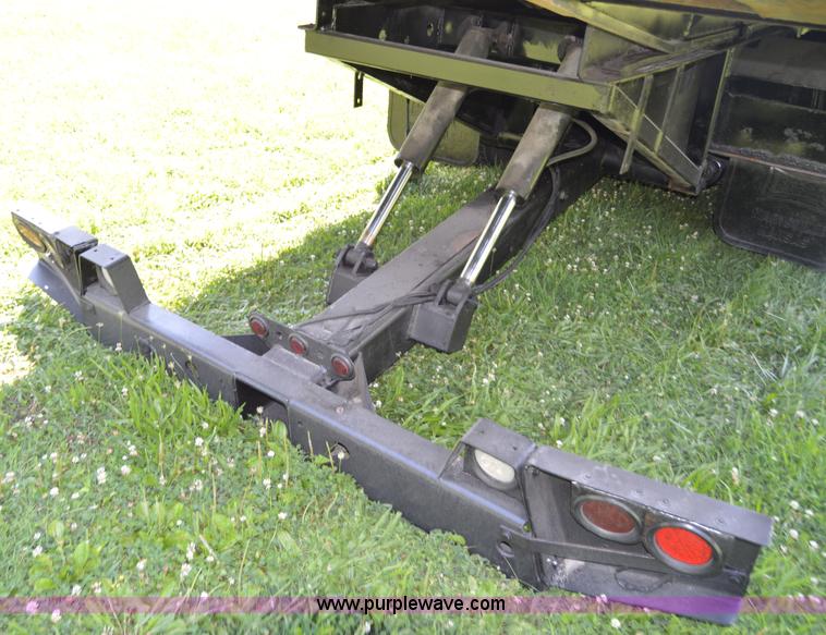 image for item H2873 1999 Volvo WG rollback truck