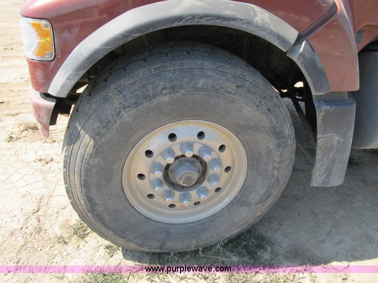 image for item Z9128 2002 Volvo VHD64F triple axle dump truck