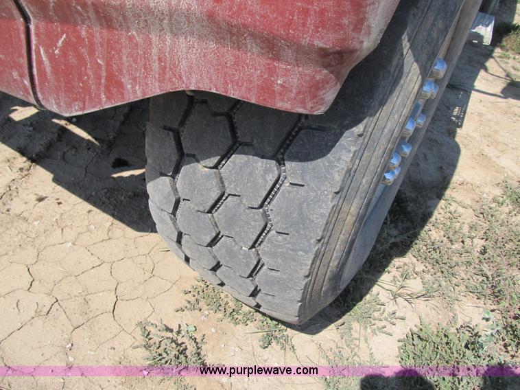 image for item Z9128 2002 Volvo VHD64F triple axle dump truck