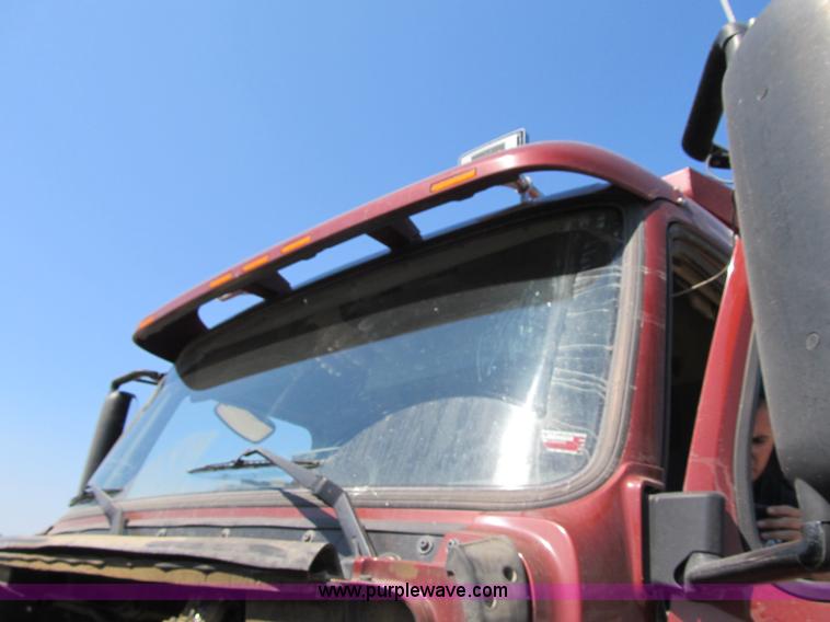 image for item Z9128 2002 Volvo VHD64F triple axle dump truck