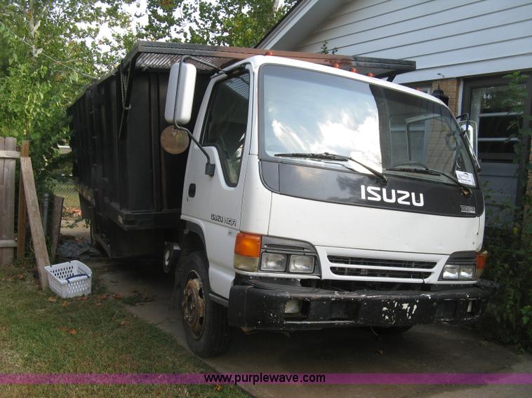 image for item E7965 2001 Isuzu NQR flatbed dump truck