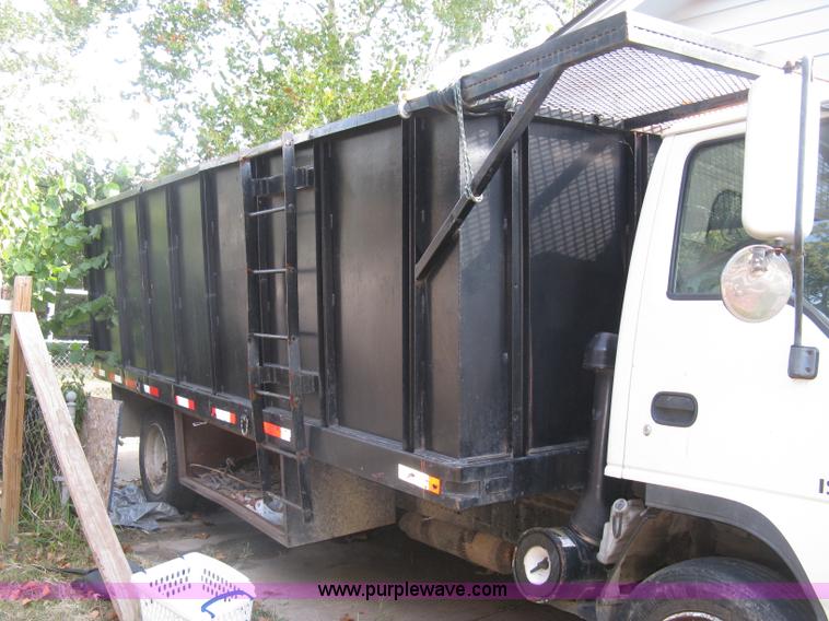 image for item E7965 2001 Isuzu NQR flatbed dump truck