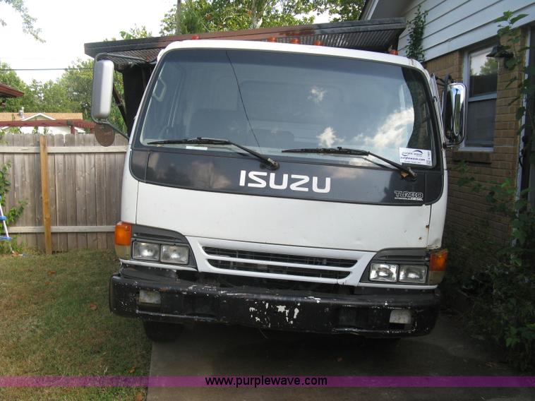 image for item E7965 2001 Isuzu NQR flatbed dump truck