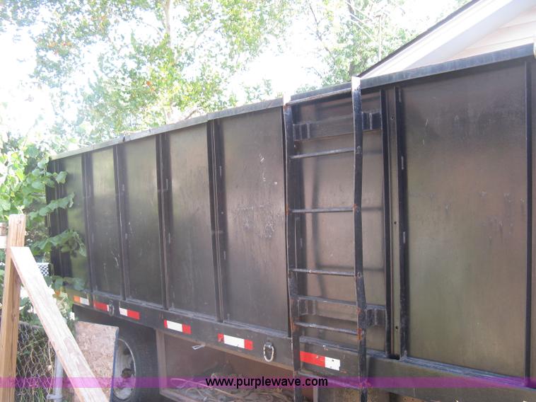 image for item E7965 2001 Isuzu NQR flatbed dump truck