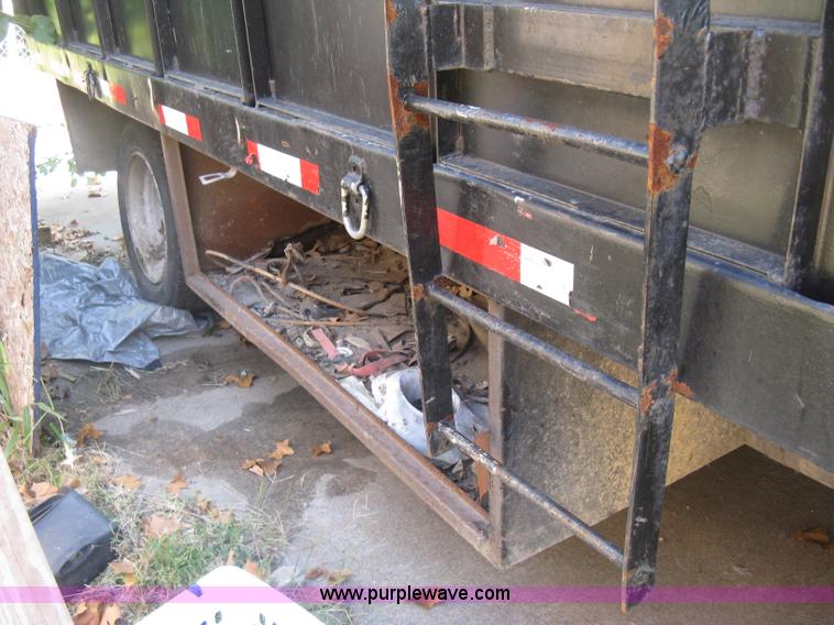 image for item E7965 2001 Isuzu NQR flatbed dump truck