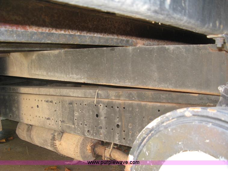 image for item E7965 2001 Isuzu NQR flatbed dump truck