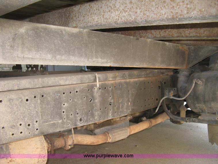 image for item E7965 2001 Isuzu NQR flatbed dump truck