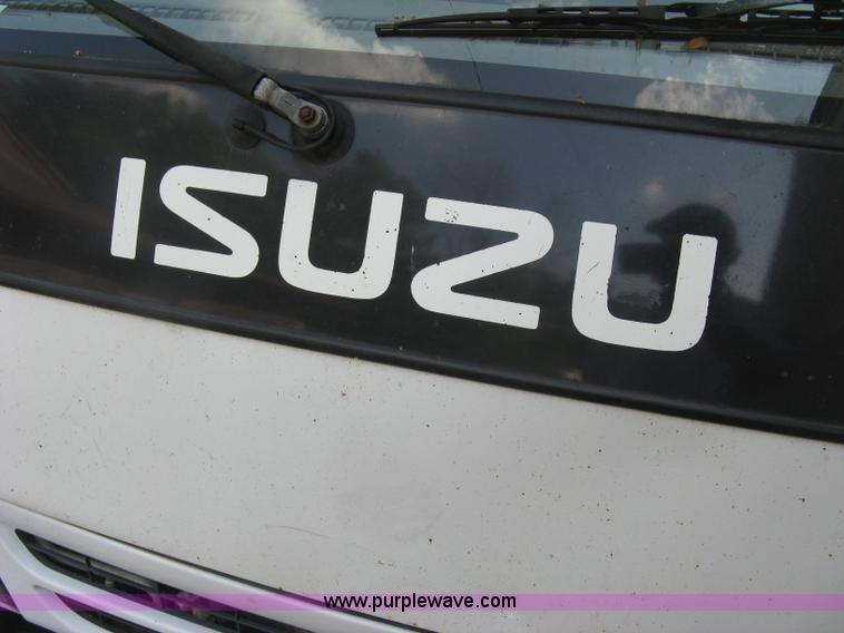 image for item E7965 2001 Isuzu NQR flatbed dump truck