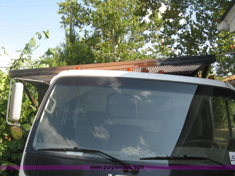 image for item E7965 2001 Isuzu NQR flatbed dump truck